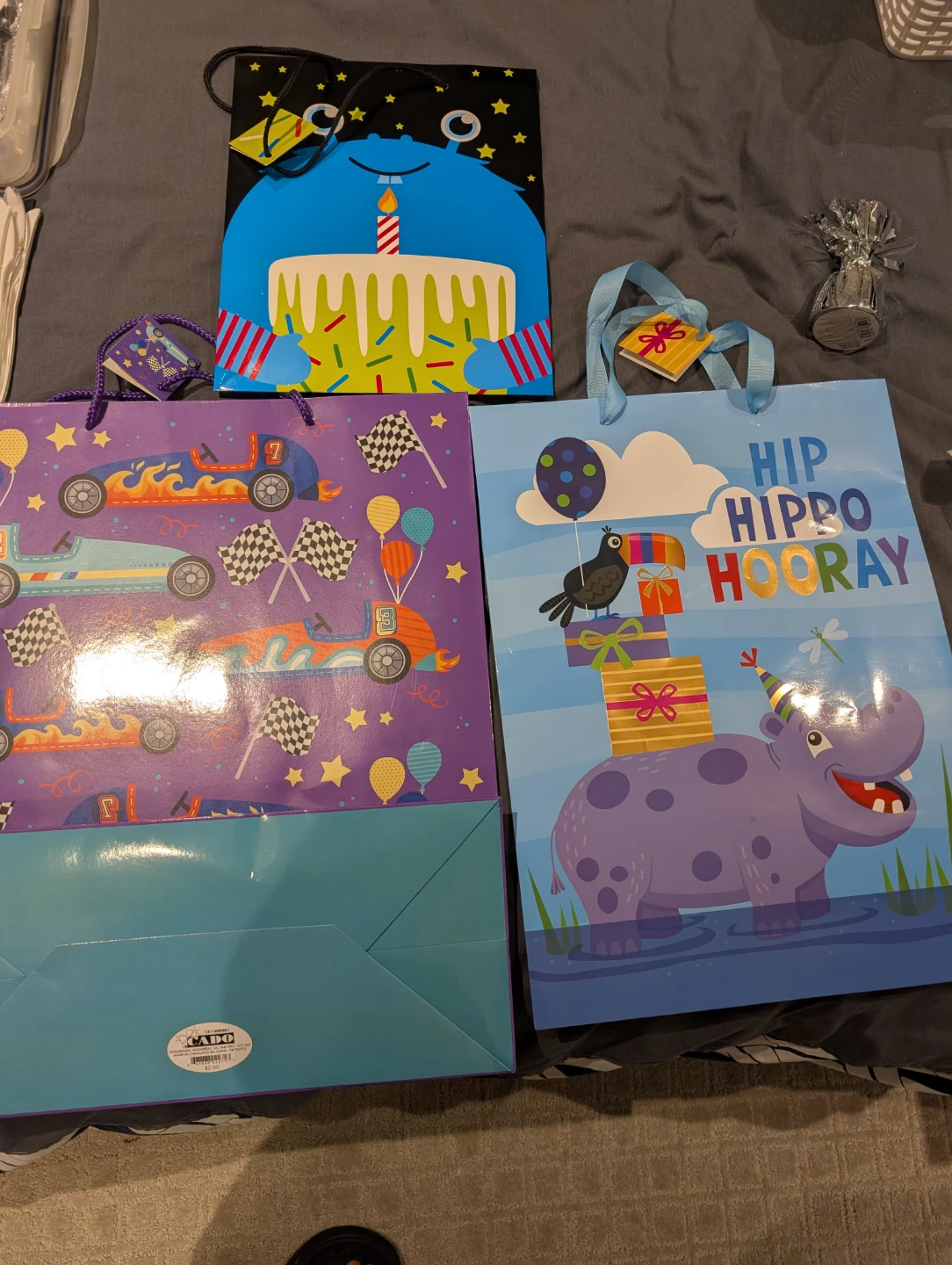 Silver Balloon Weight and three children gift bags