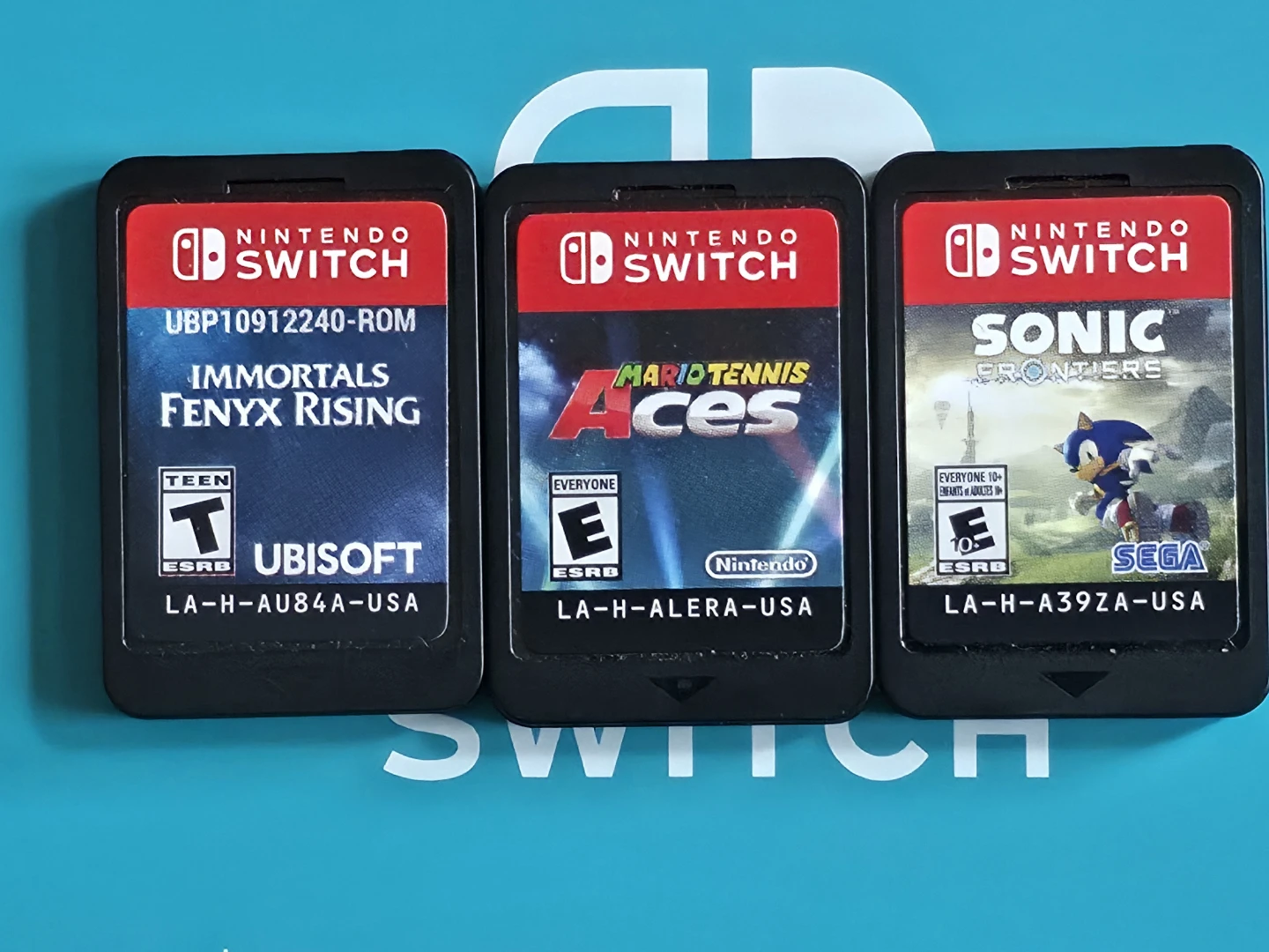 Nintendo Switch lite Coral Blue + 3 games - photo 3