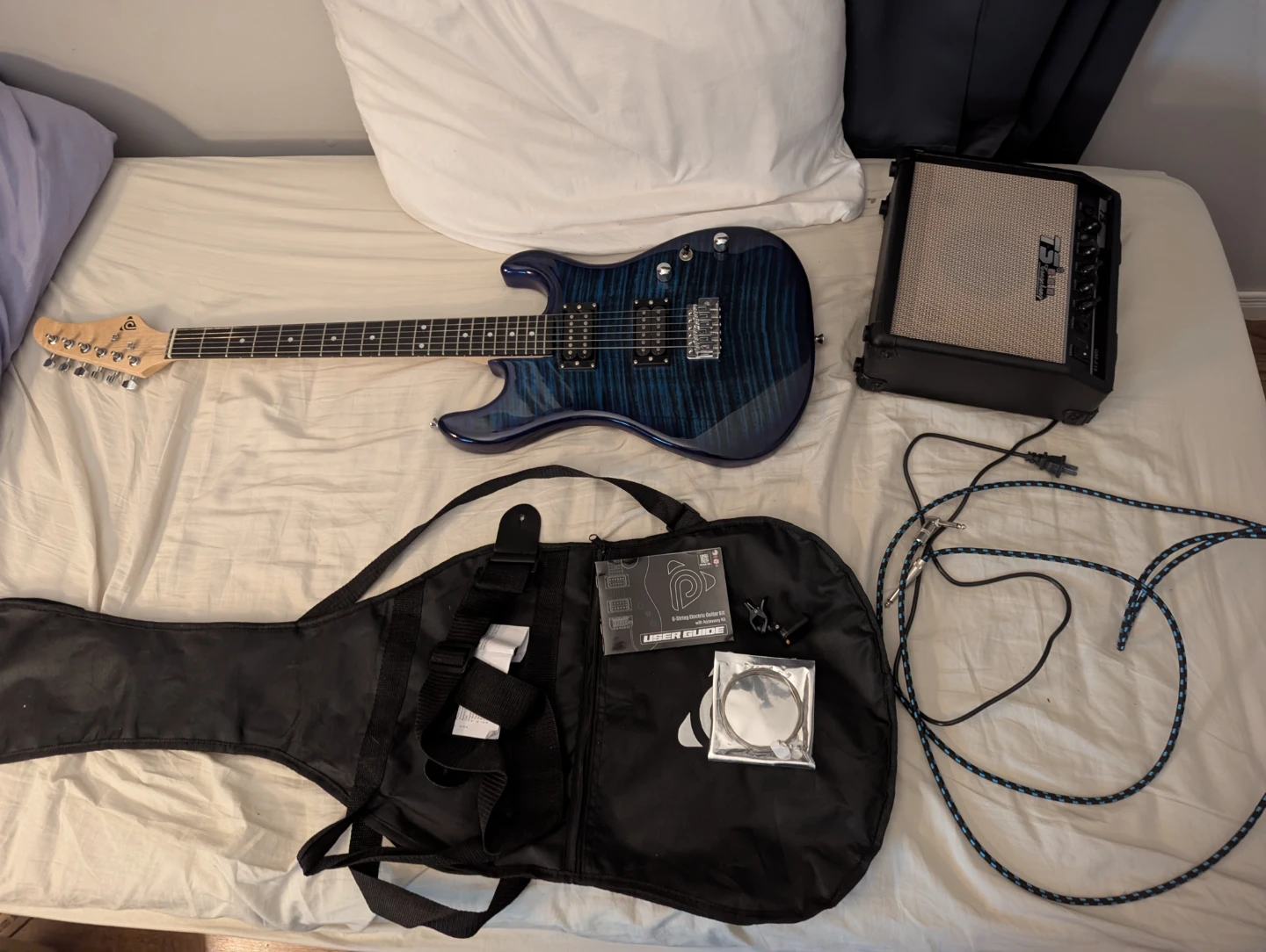 Electric Guitar Kit with Amp, Guitar Case, and Accesories.