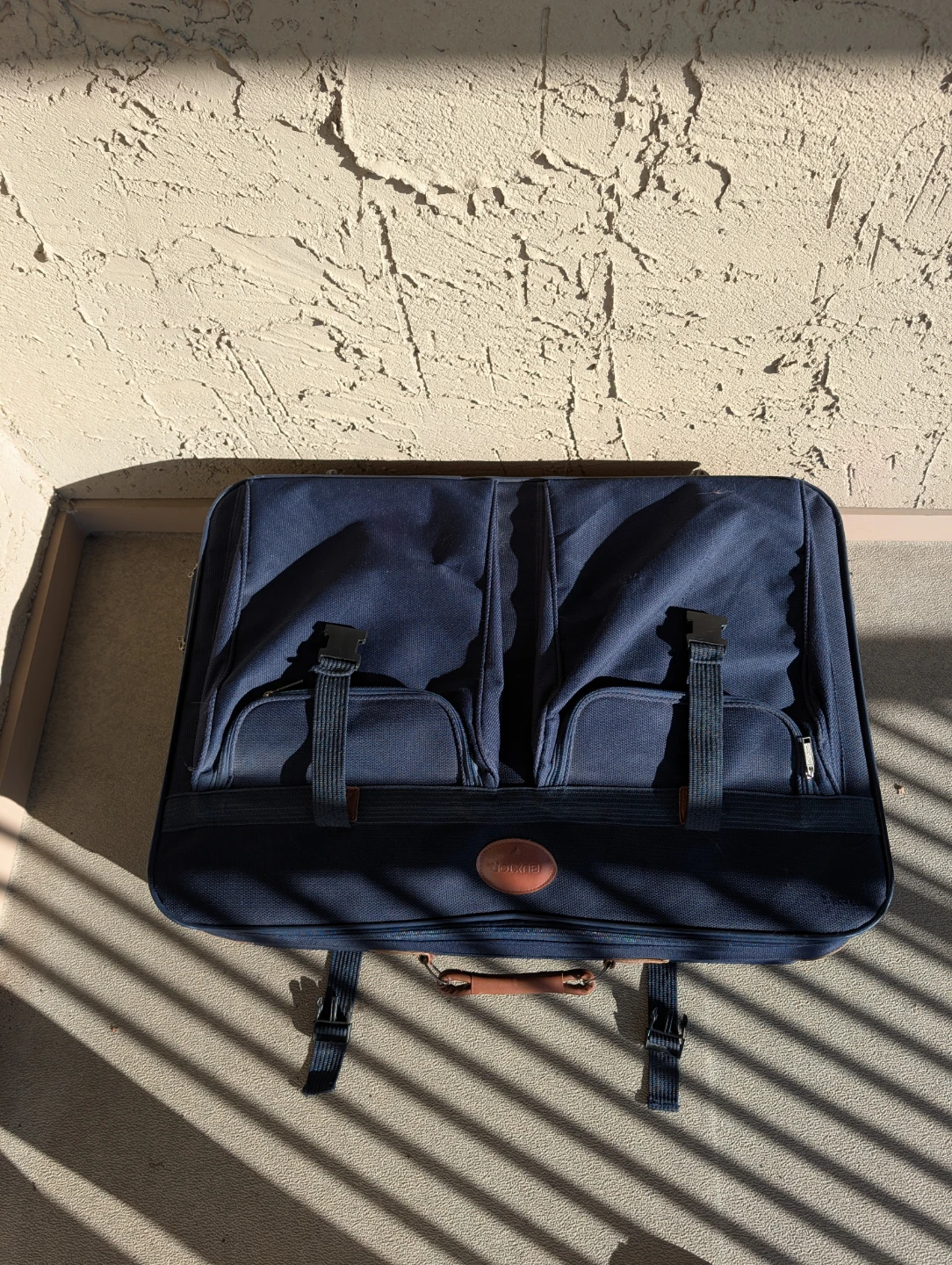 Buxton Navy Rolling Suitcase