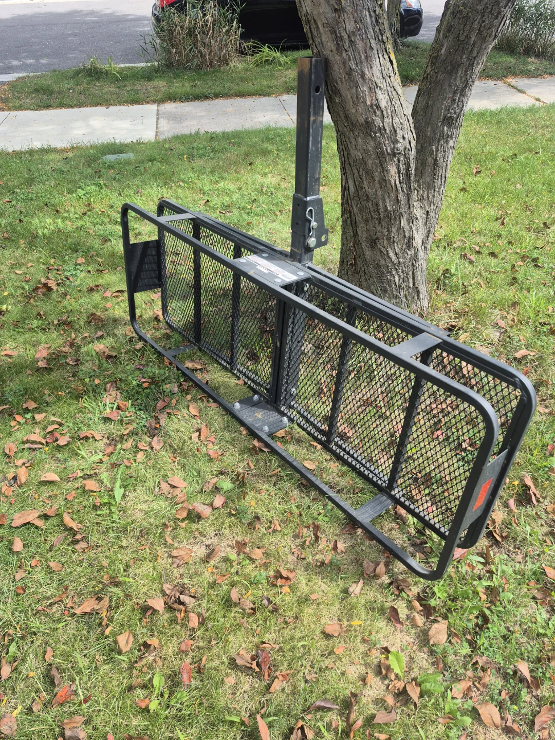 Black hitch-mount cargo carrier