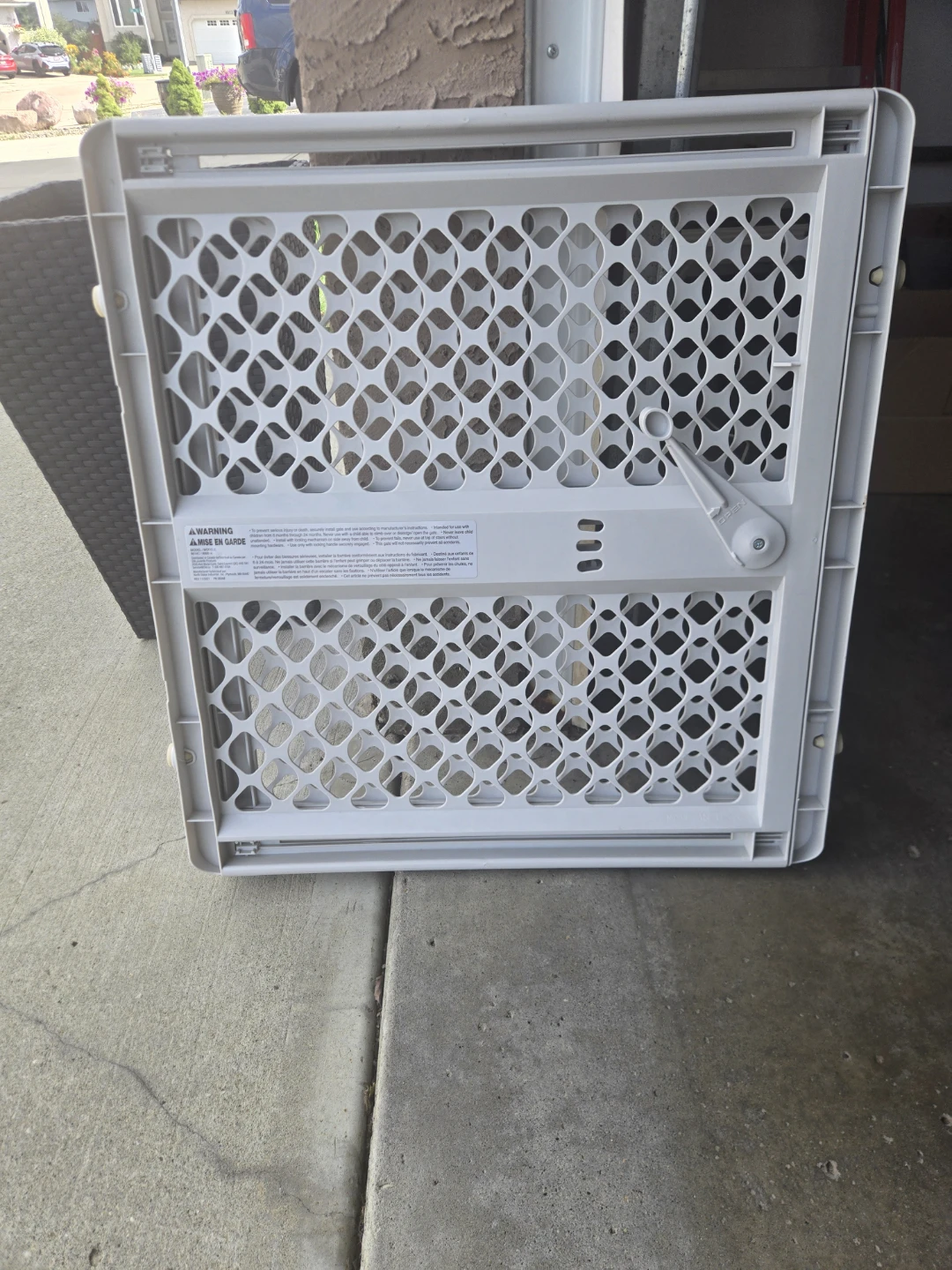 White plastic adjustable baby gate