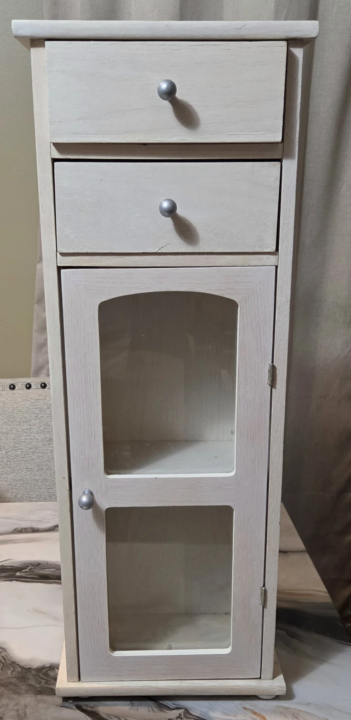 Small wooden cabinet with drawers