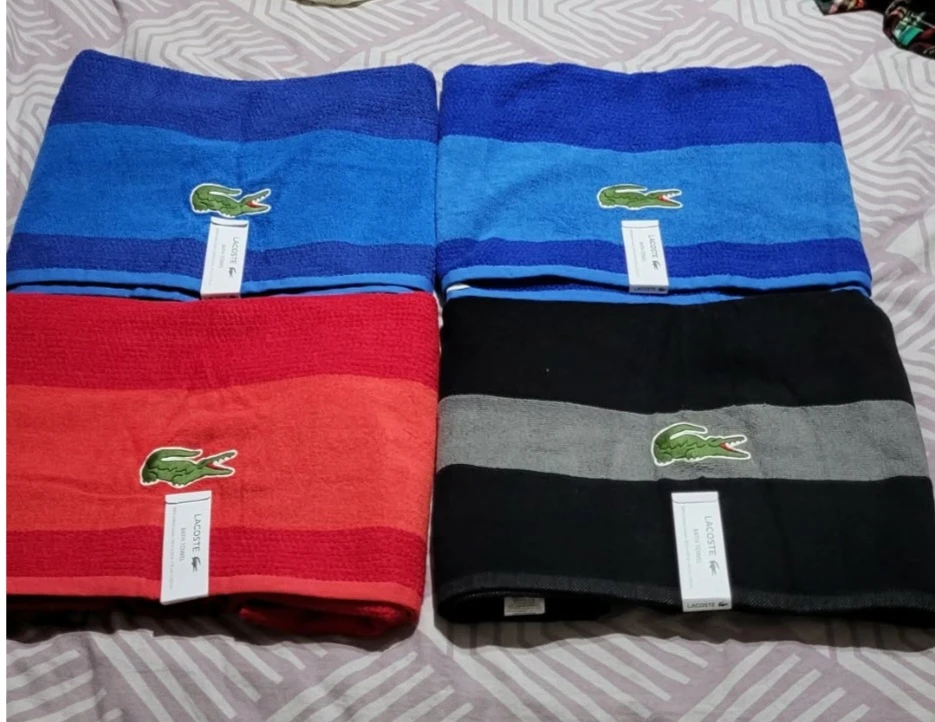 Four Lacoste Bath Towels each 100$