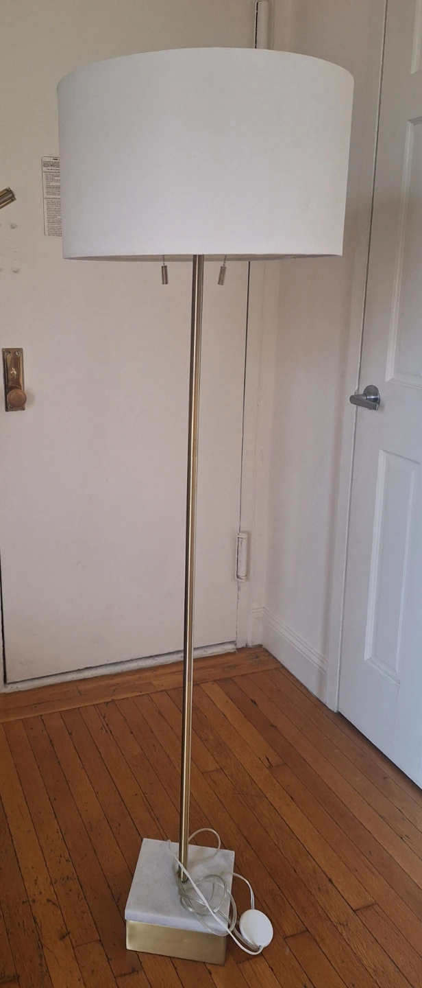Floor lamp with white drum shade and marble base