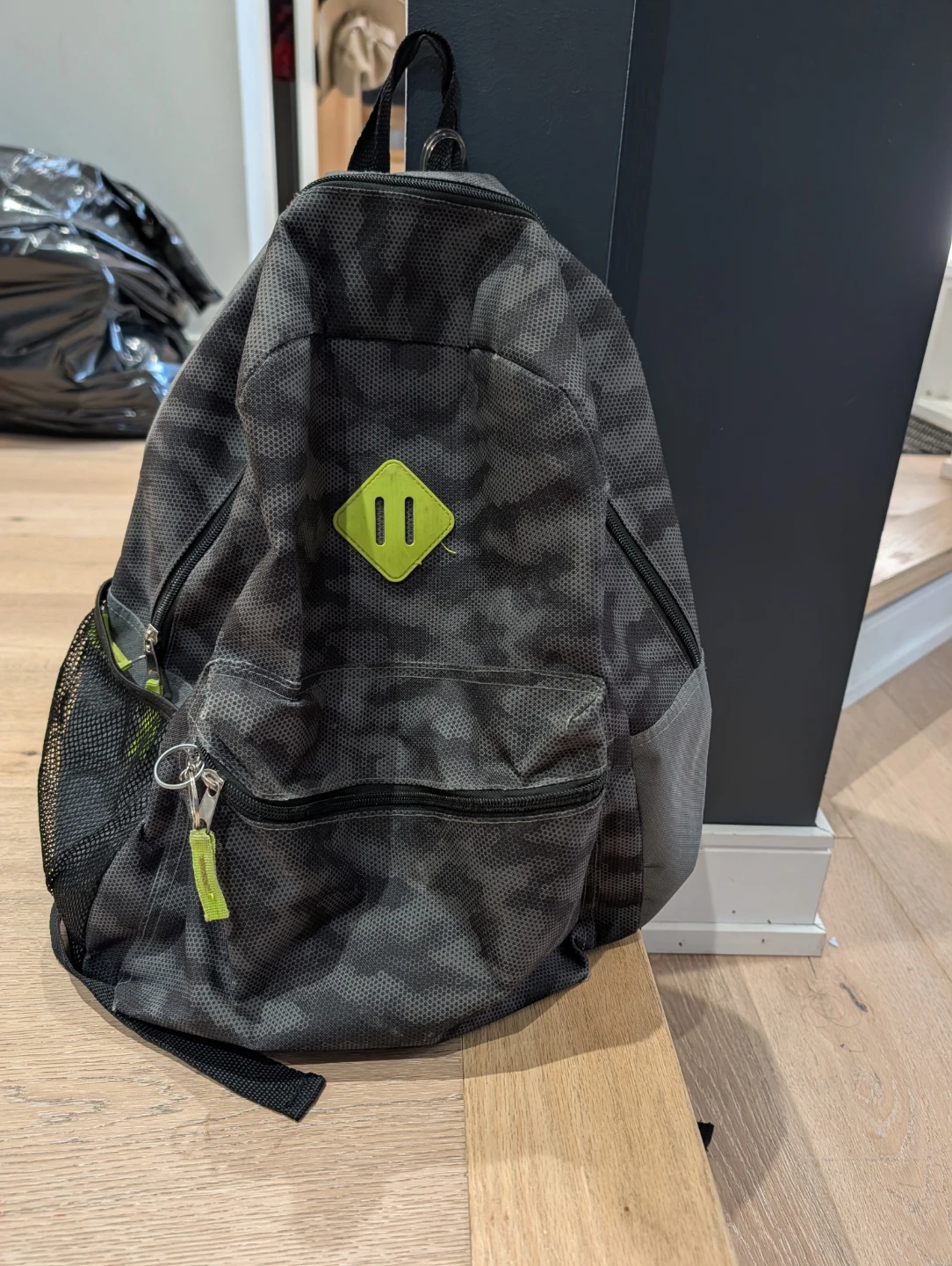Camo pattern backpack with lime green accents