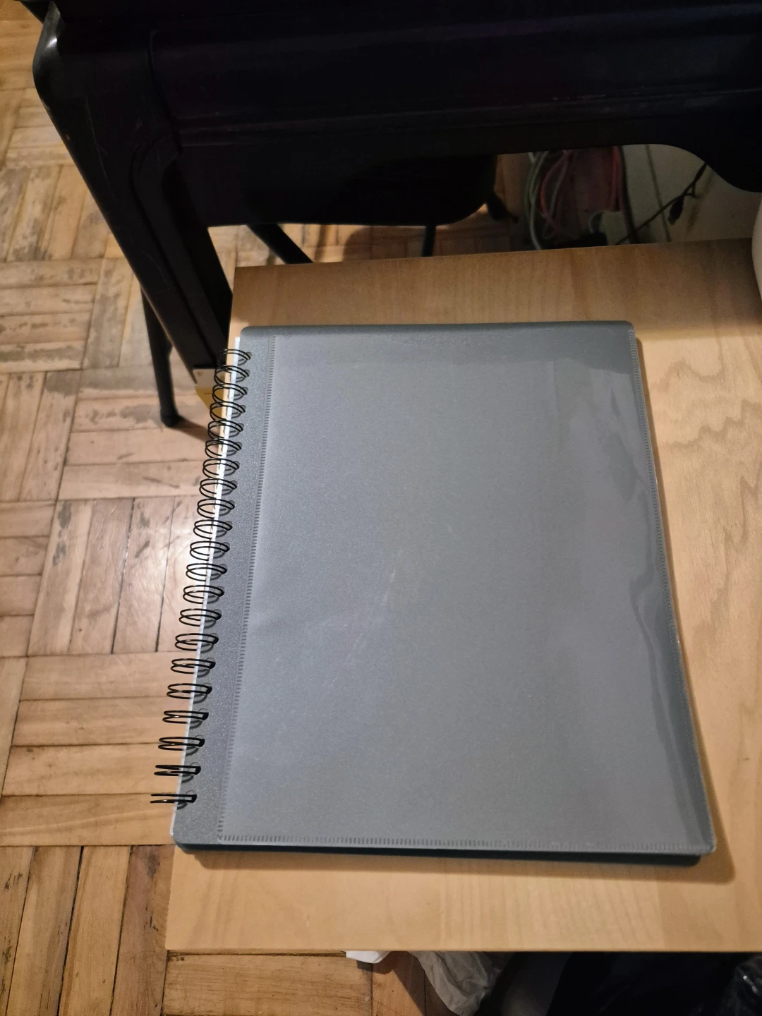 Gray Spiral-Bound Binder with Clear Pockets