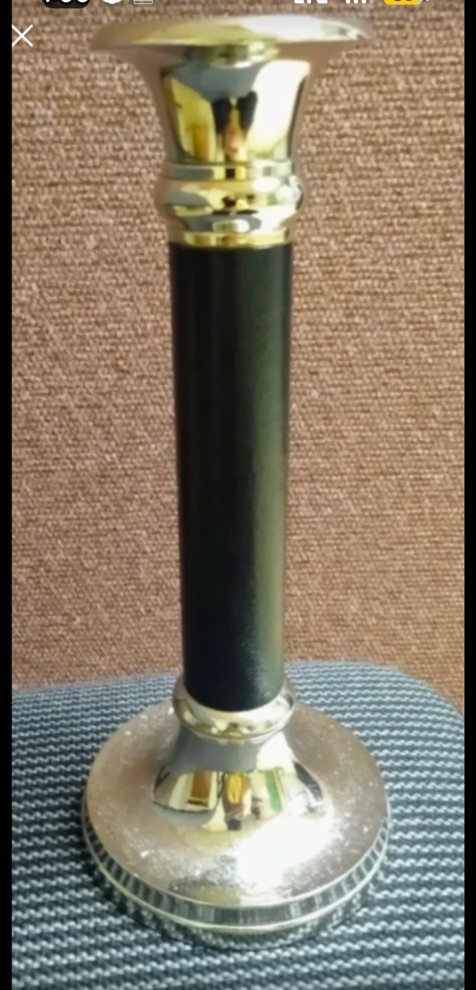 Black and gold metal candlestick holder