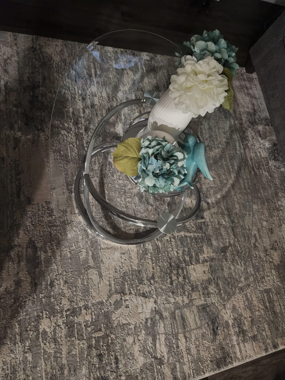 Modern oval glass coffee table with chrome base