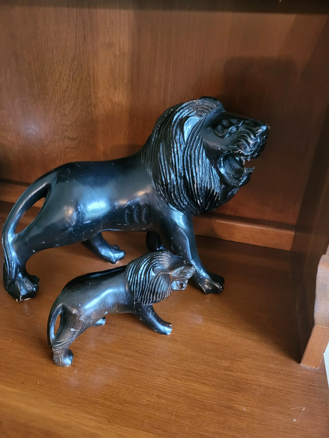 Two Vintage Carved Black Lion Figurines