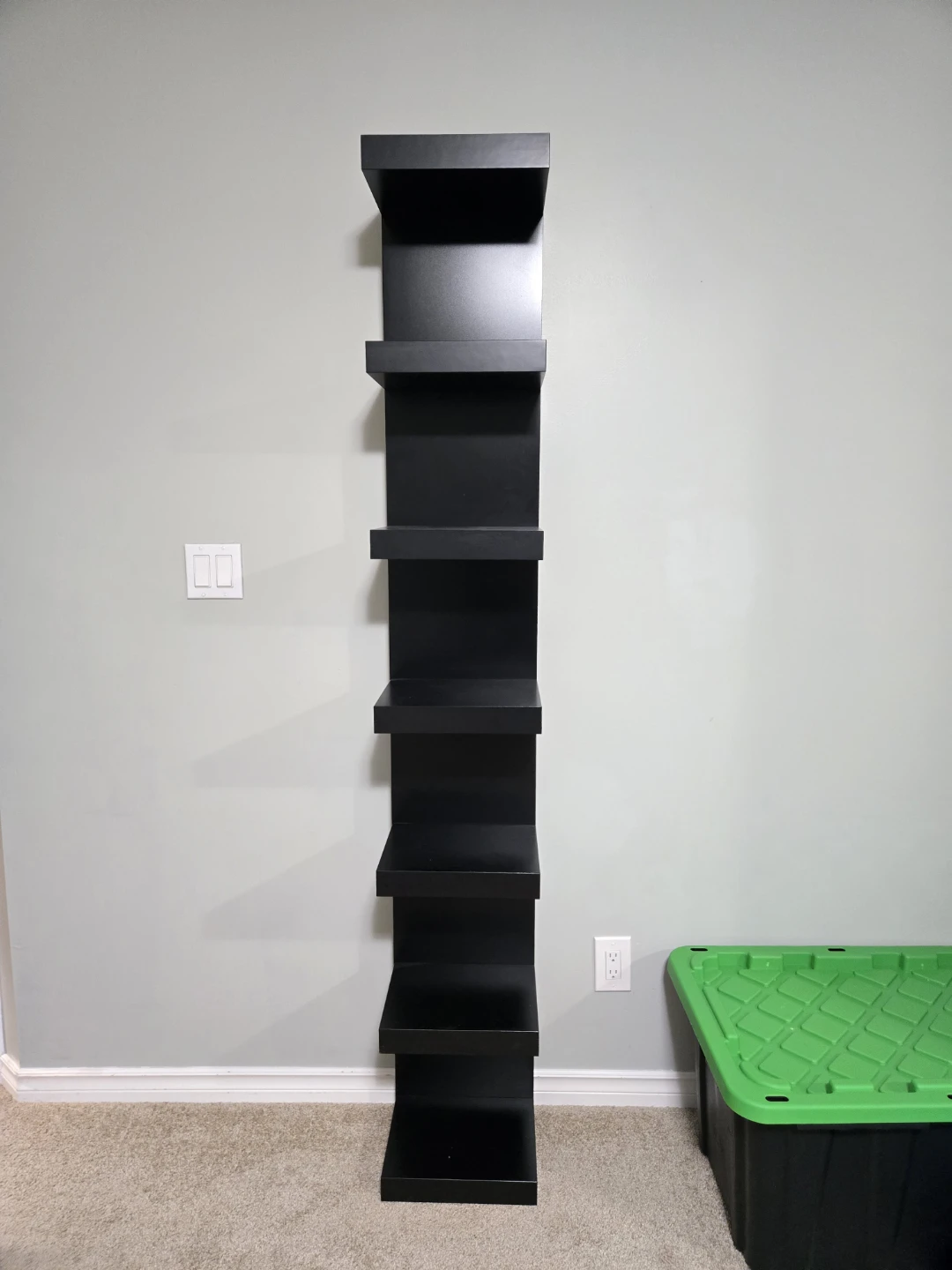 Black wall-mounted tower shelf