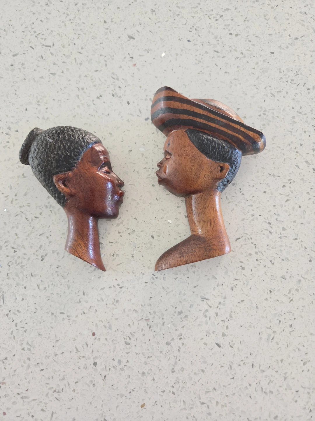 Set of two hand-carved wooden wall plaques