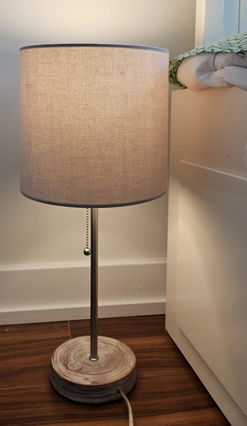 Table lamp with fabric shade and wooden base