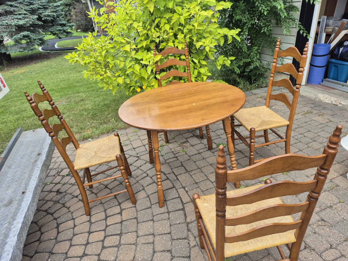Wooden Dining Table with Four Ladder-Back Chairs