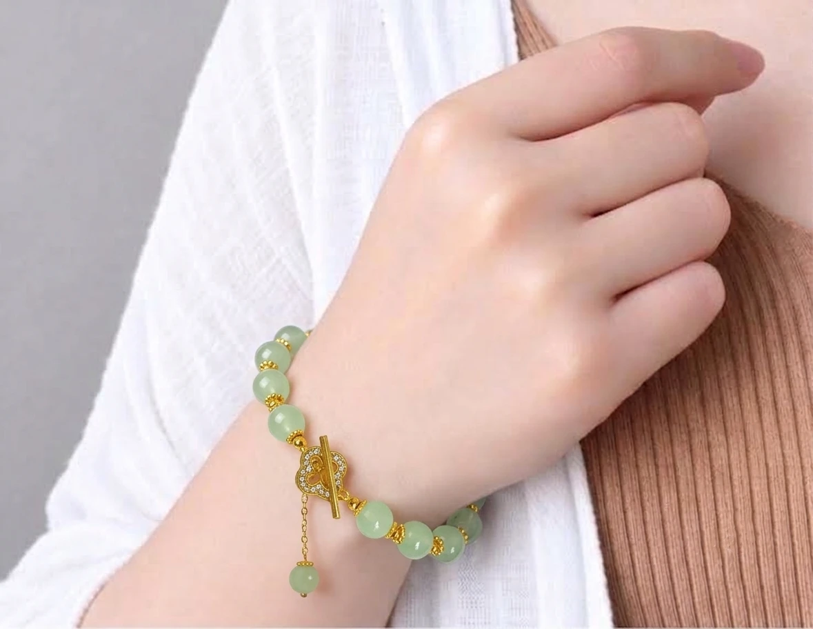 Jade bracelet with gold-tone toggle clasp