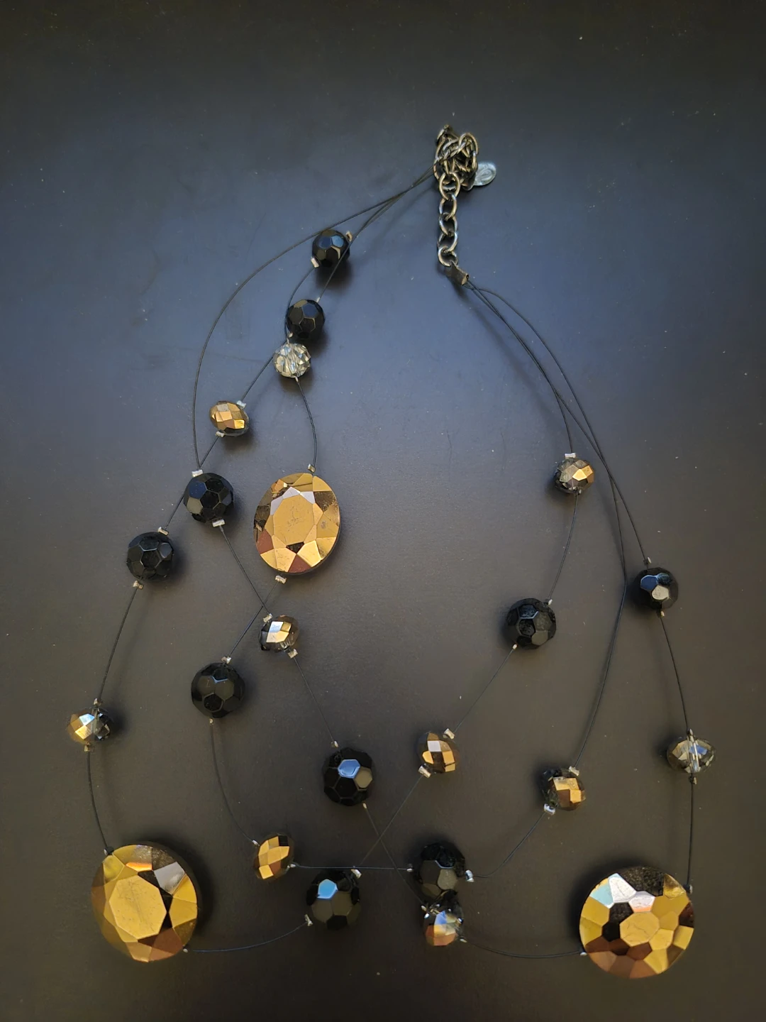 Black and gold tone beaded necklace