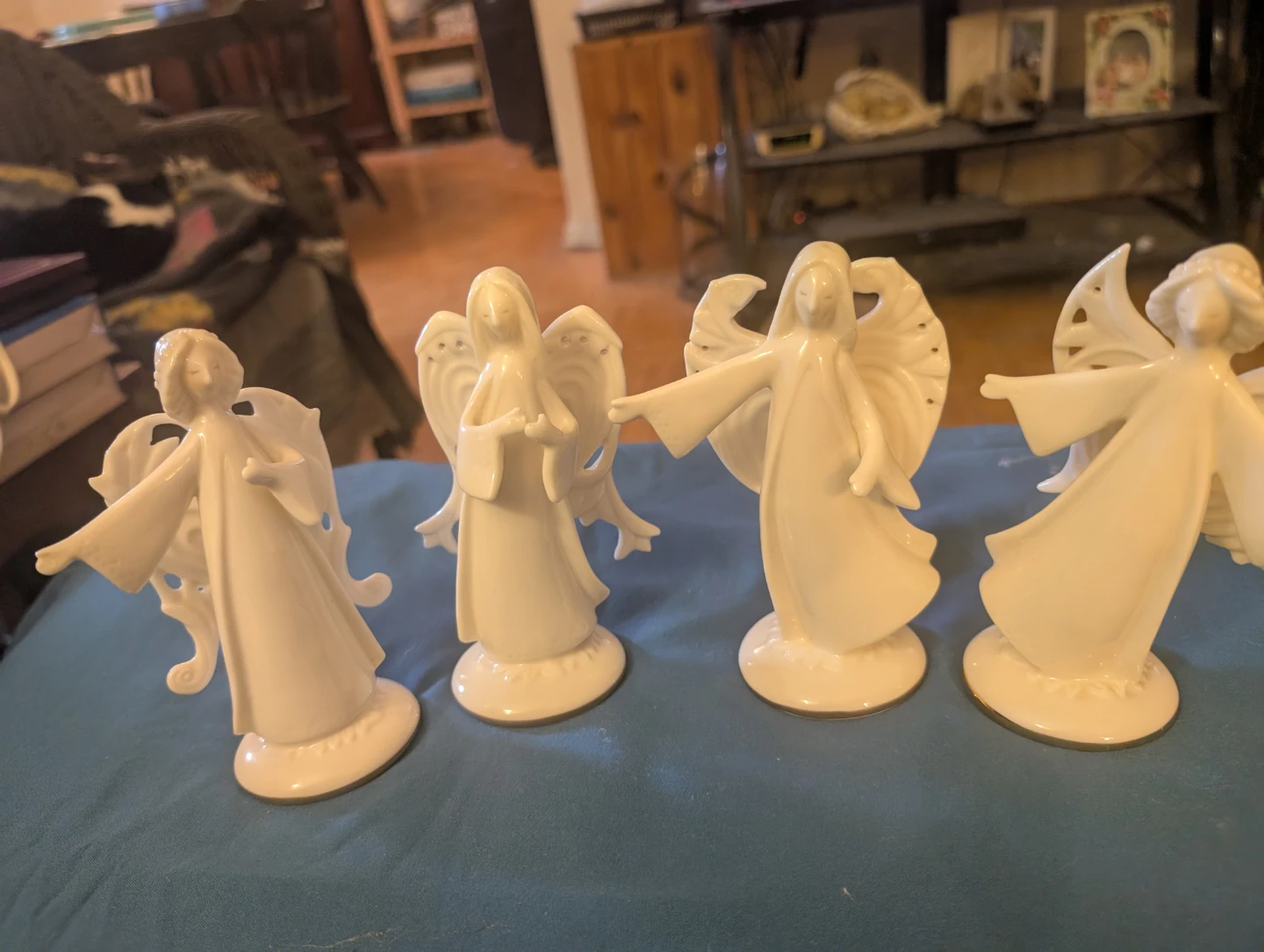 Set of 4 white porcelain angel figurines
