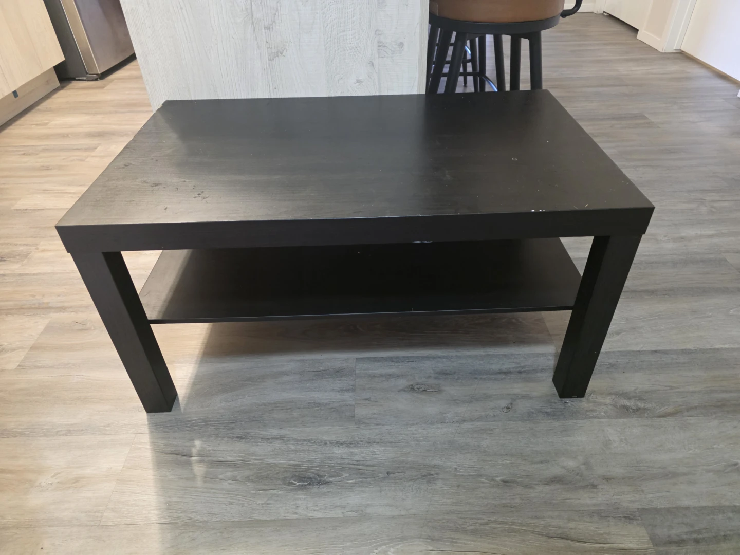 Black coffee table with shelf