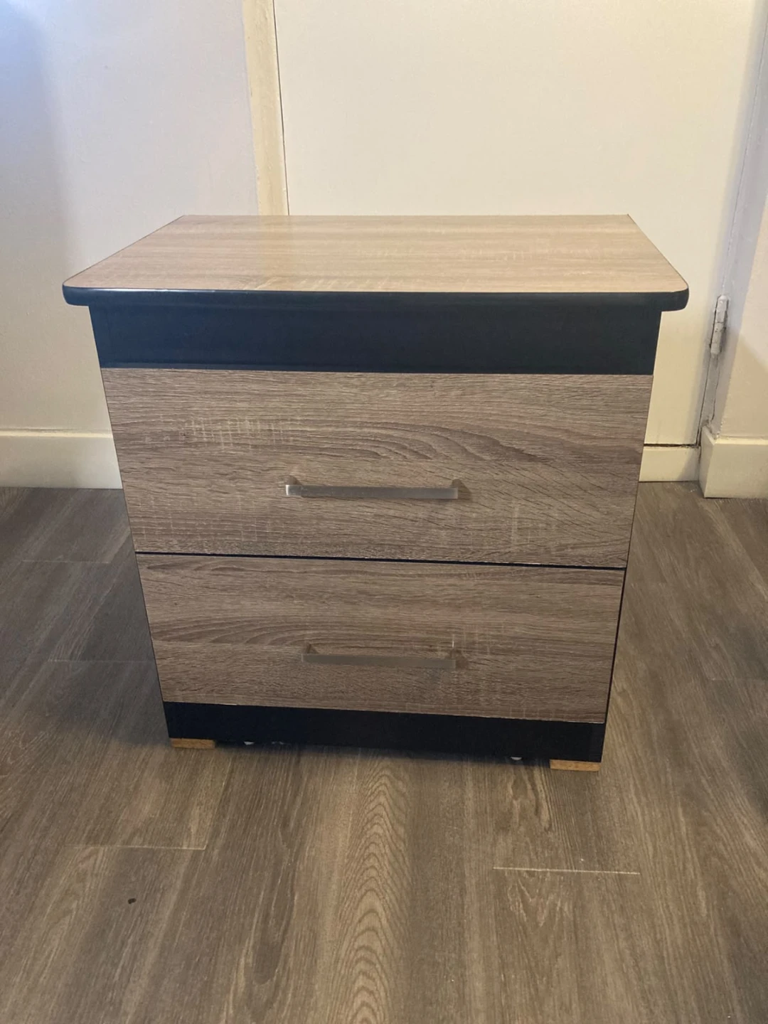 Two-drawer nightstand with wood-grain finish