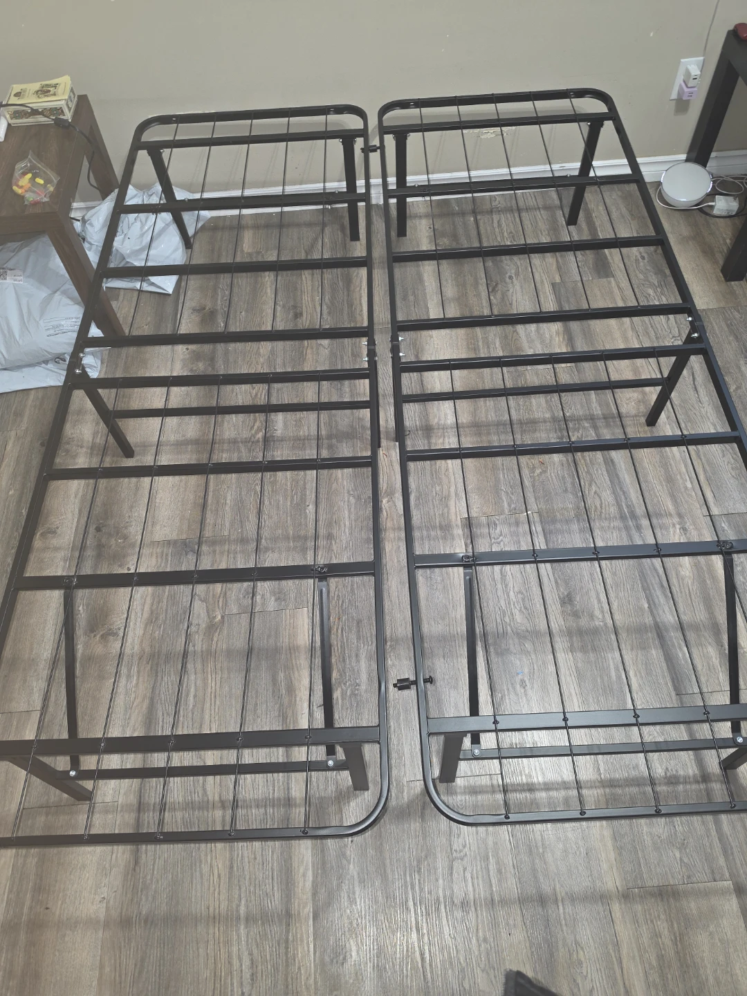 Two single metal bed frames