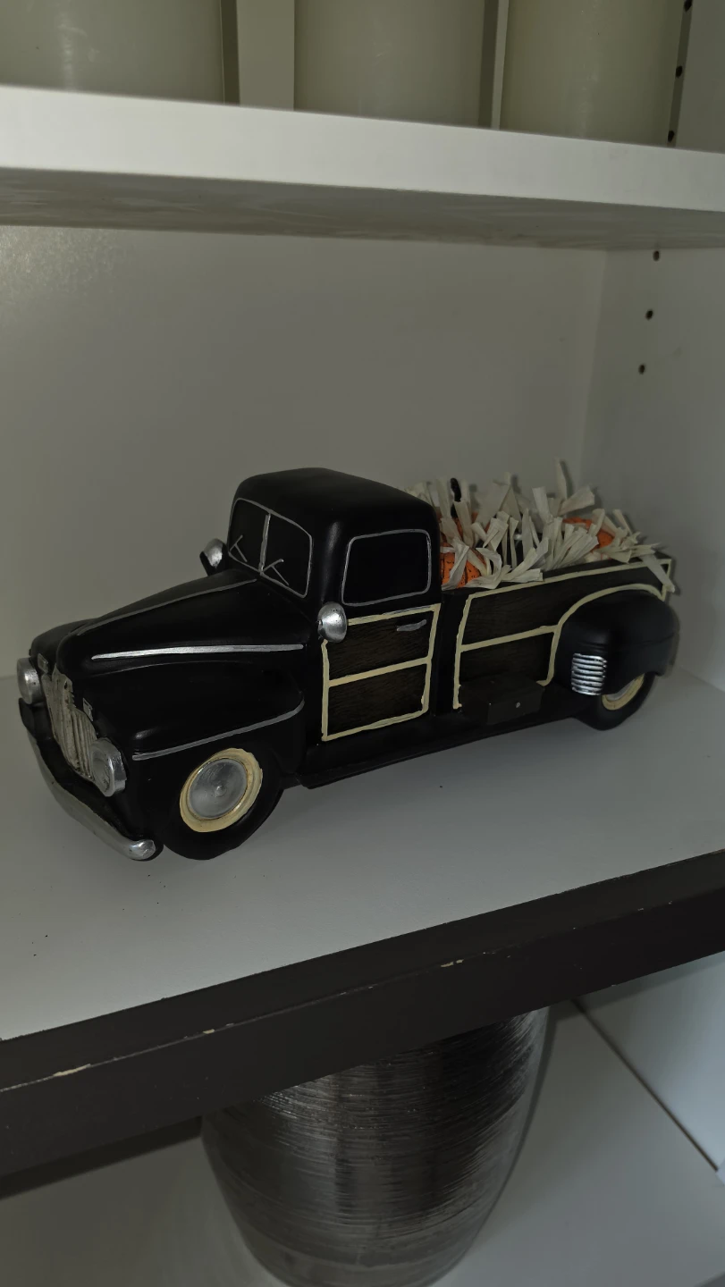 Black vintage-style harvest truck decor for Halloween