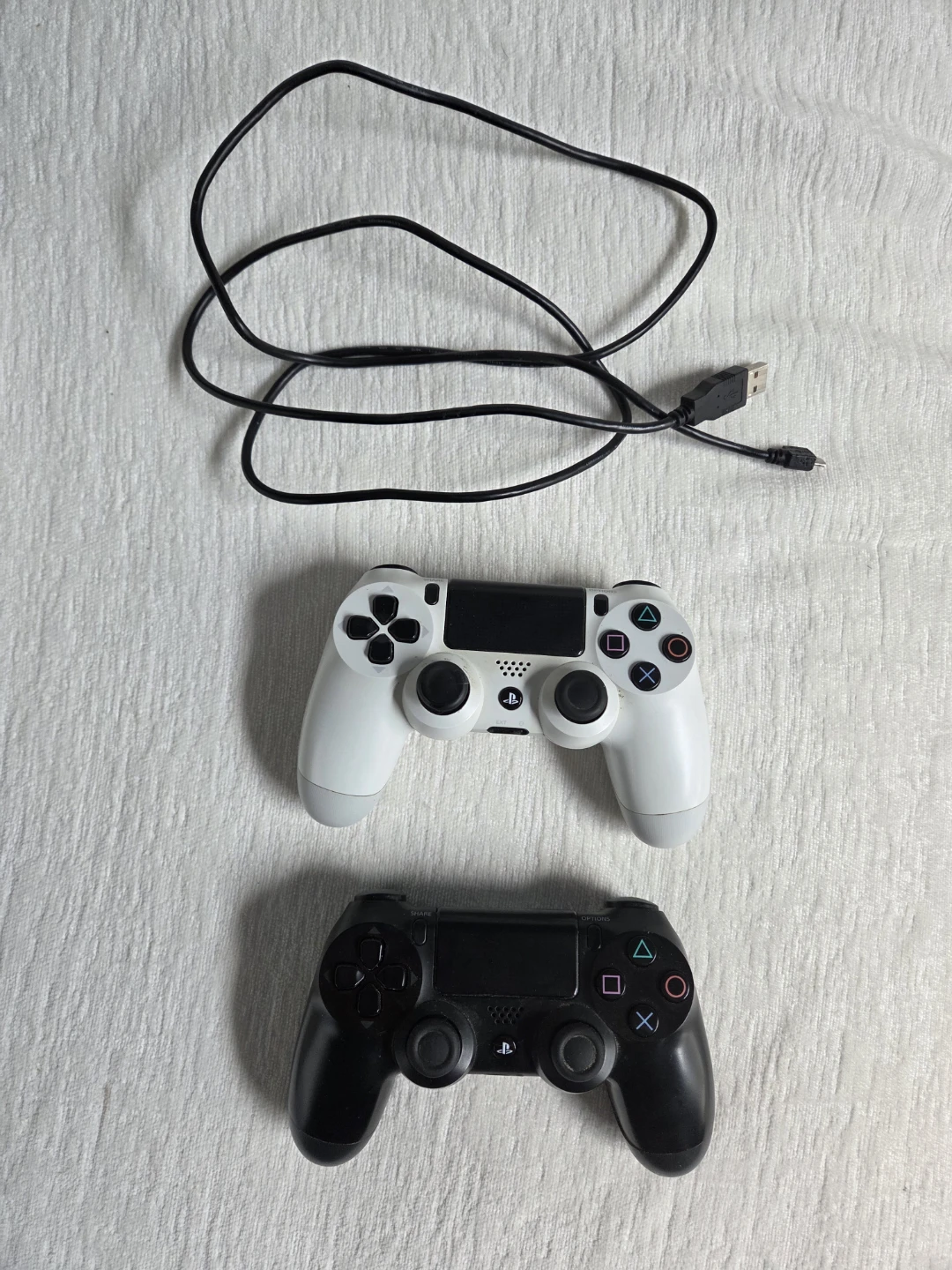 Two Sony PlayStation 4 Controllers