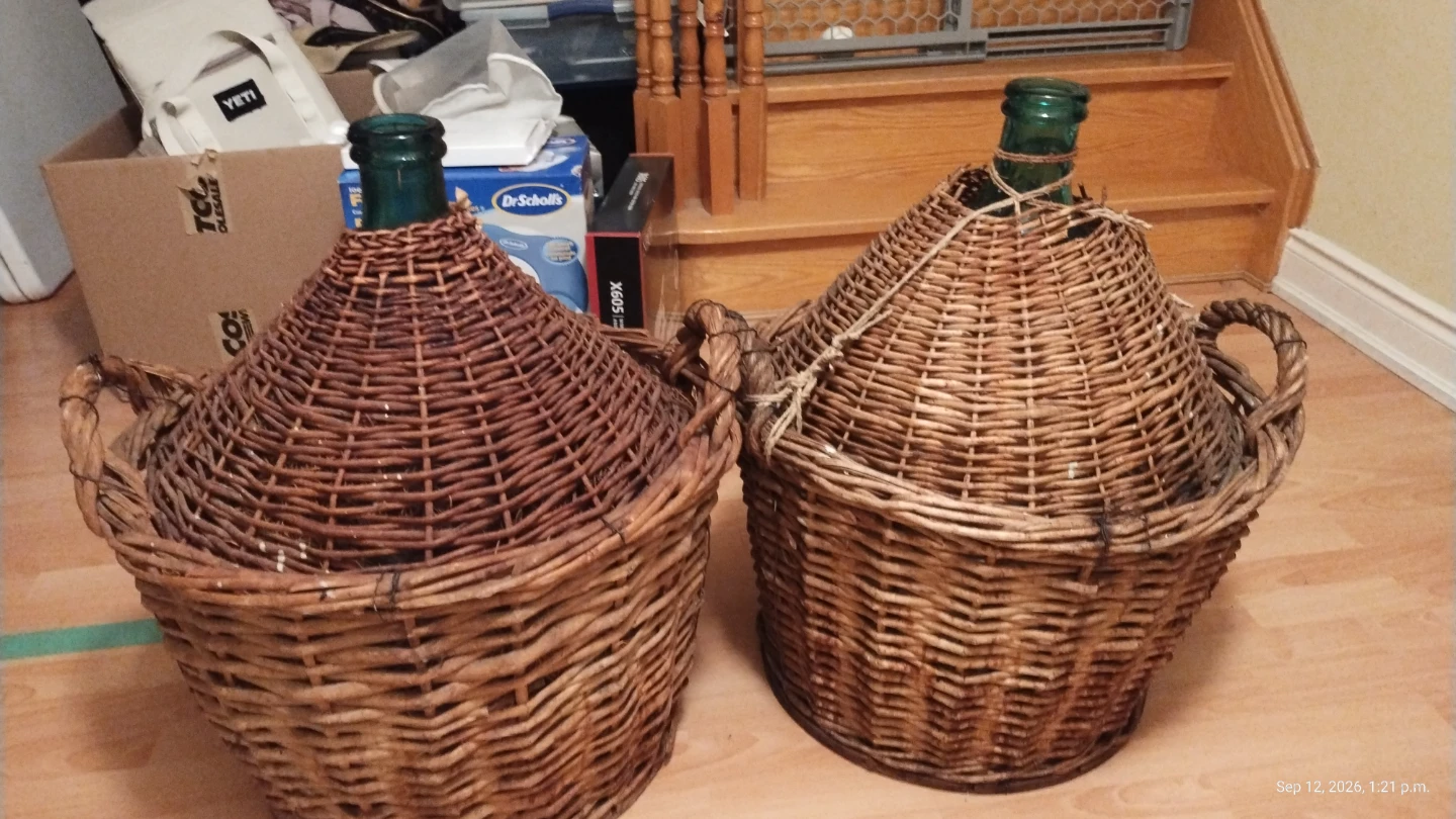 Two Vintage Wicker Covered Glass Demijohn Bottles
