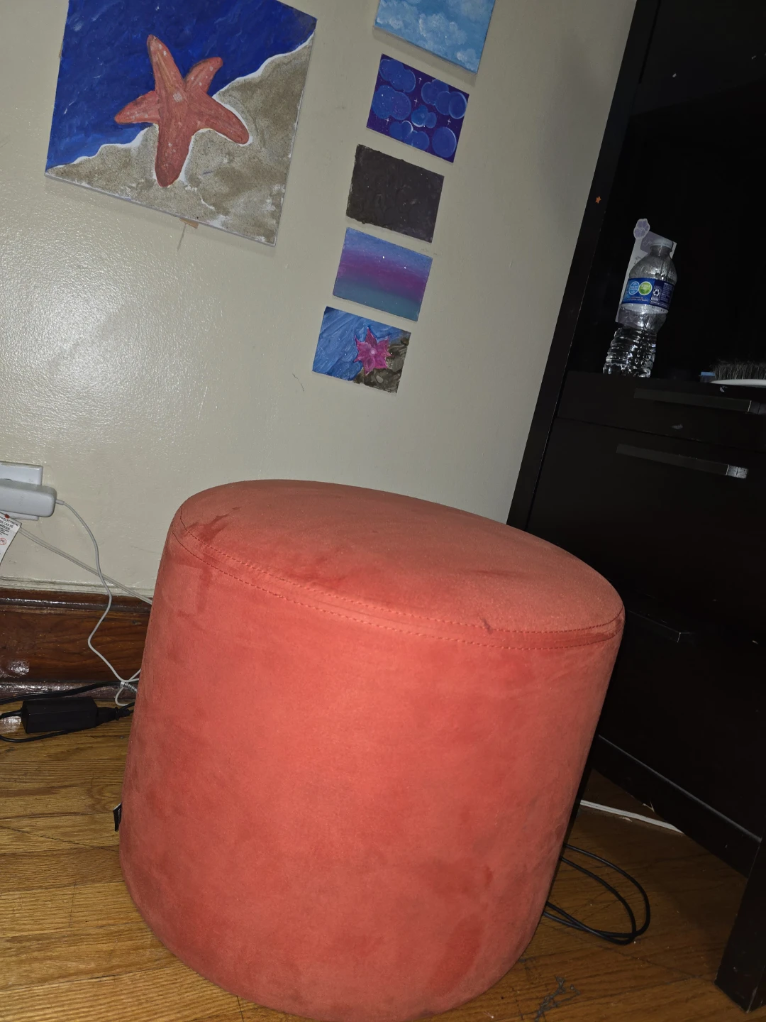 Orange round ottoman footstool