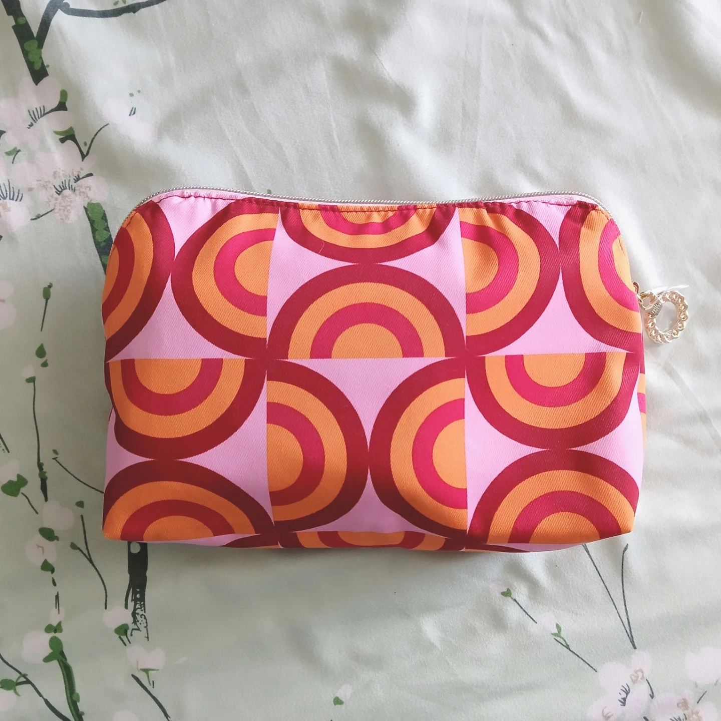 Reversible floral and geometric print pouch 🏈