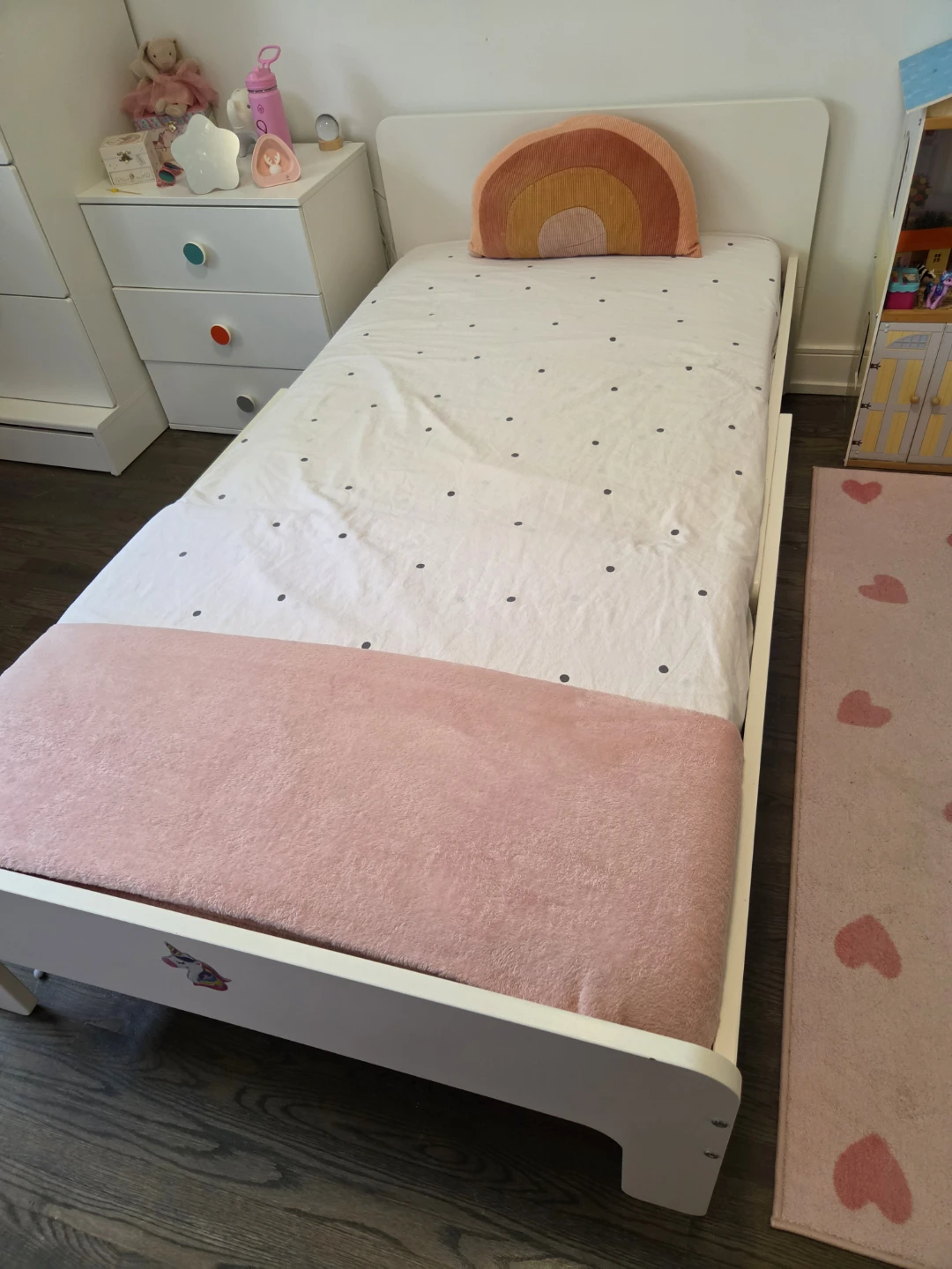 Ikea extendable kid bed frame in white.