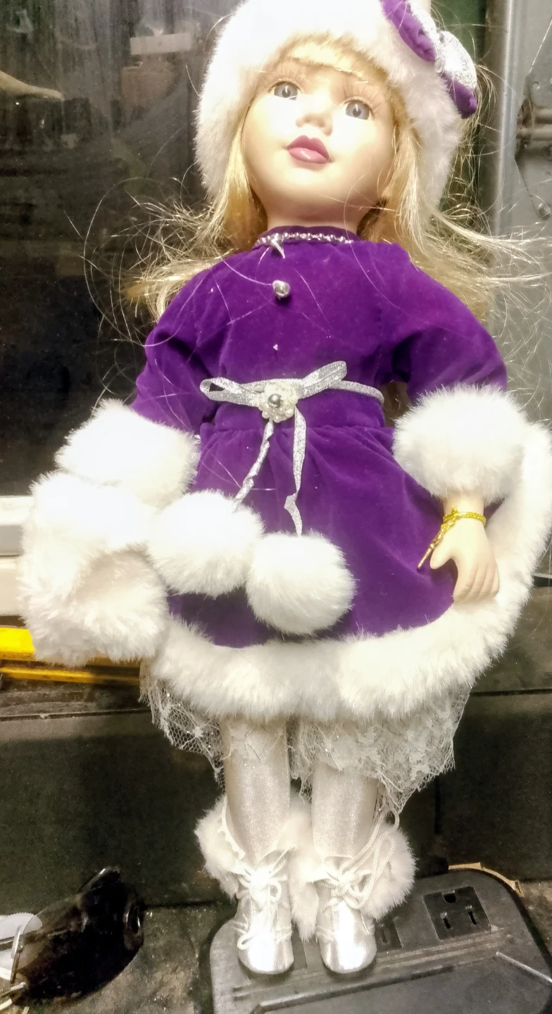Collectible Porcelain Doll in Purple Velvet