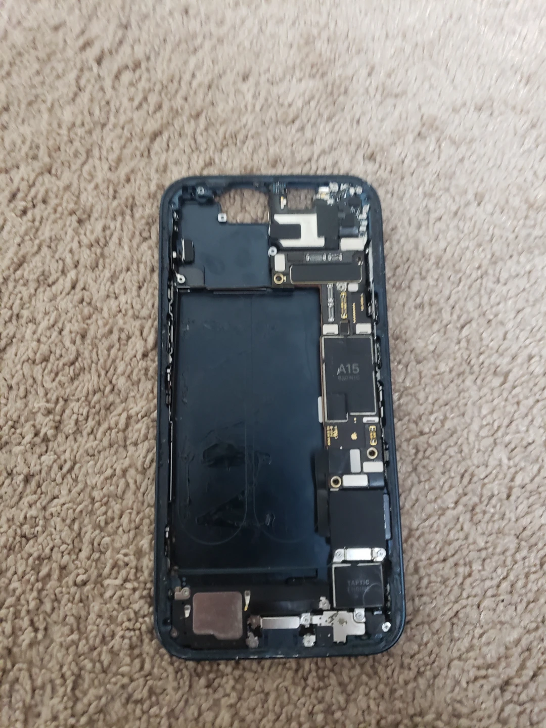 iPhone 14 middle frame with motherboard and other parts