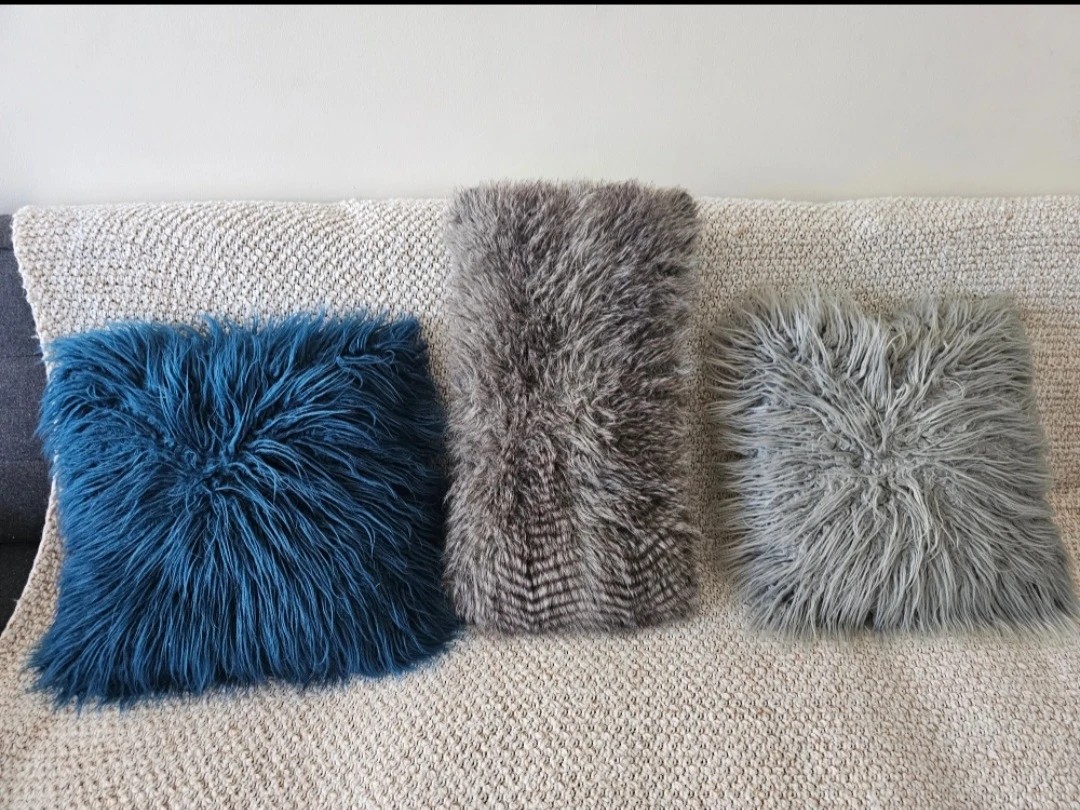 Set of three faux fur cushions
