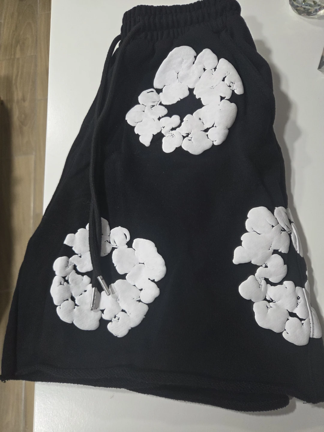 Black shorts with white floral patterns