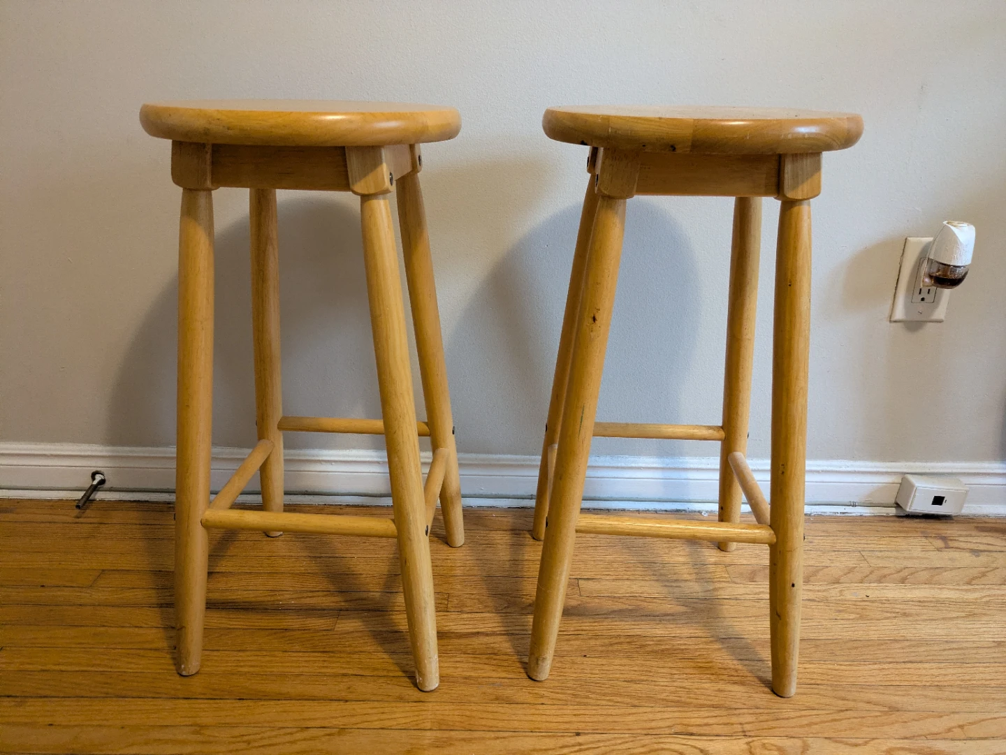 Two wooden bar stools