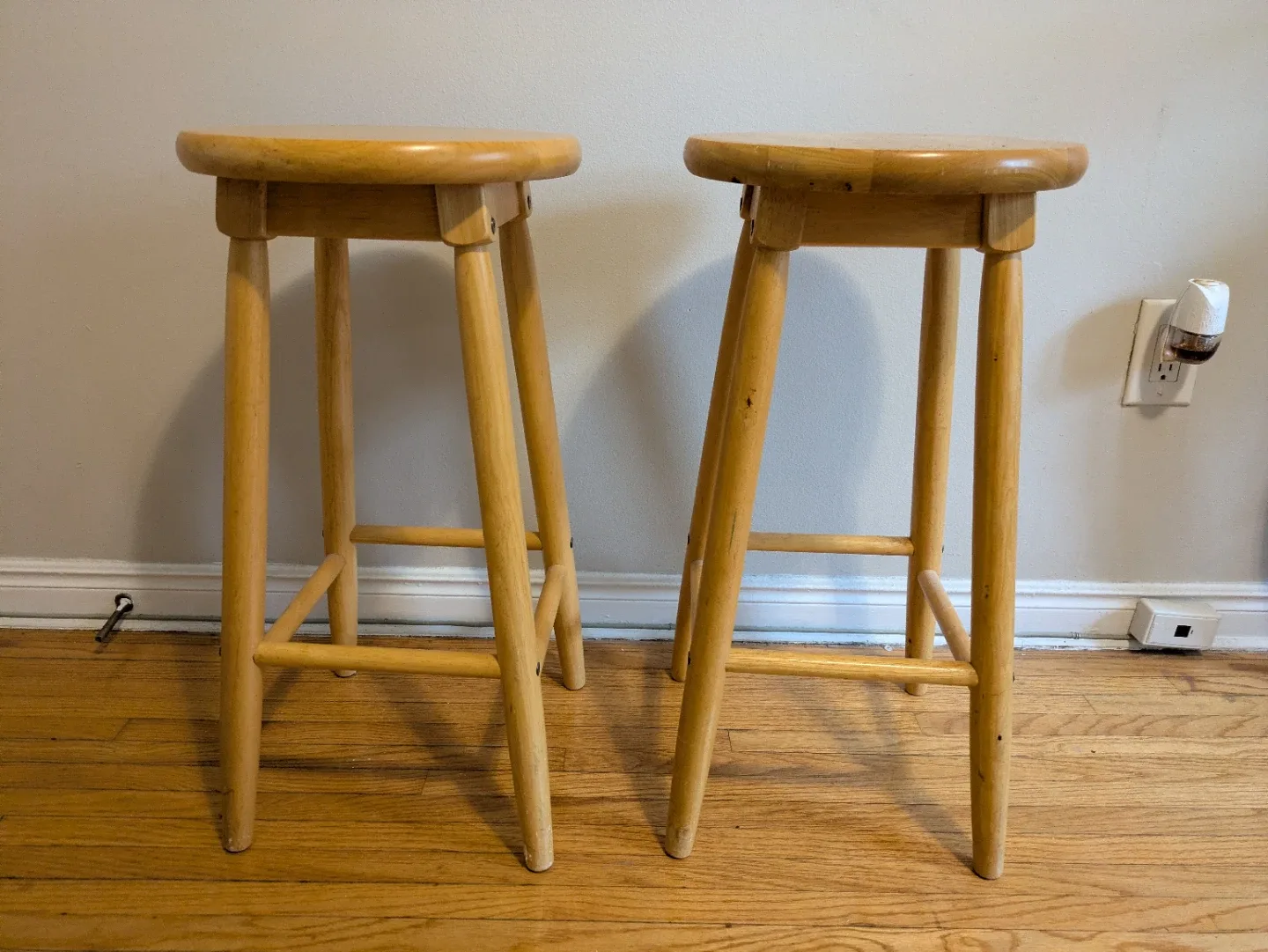 Two wooden bar stools