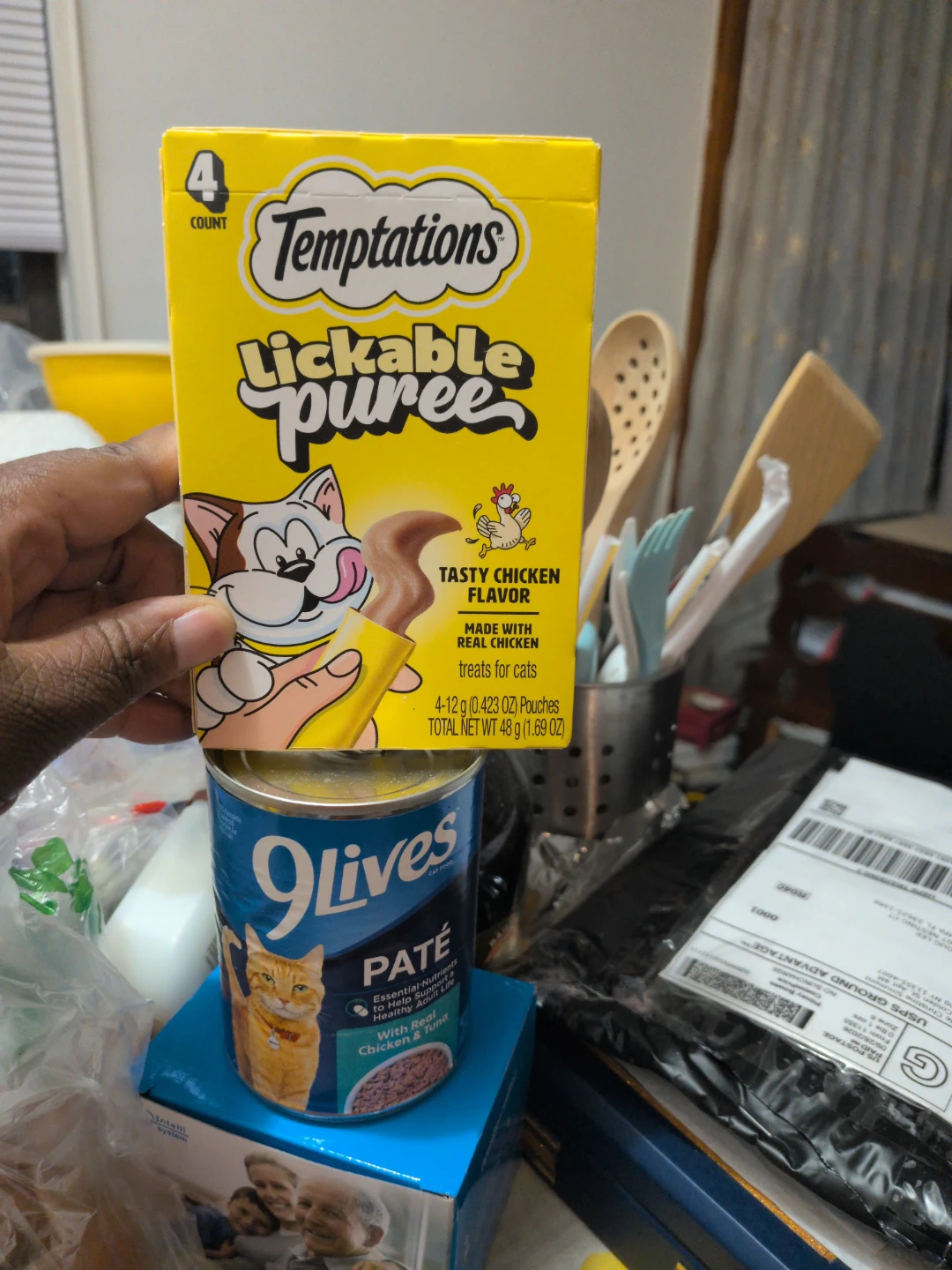 Temptations Lickable Puree Cat Treats and a Can of 9 Lives Pate