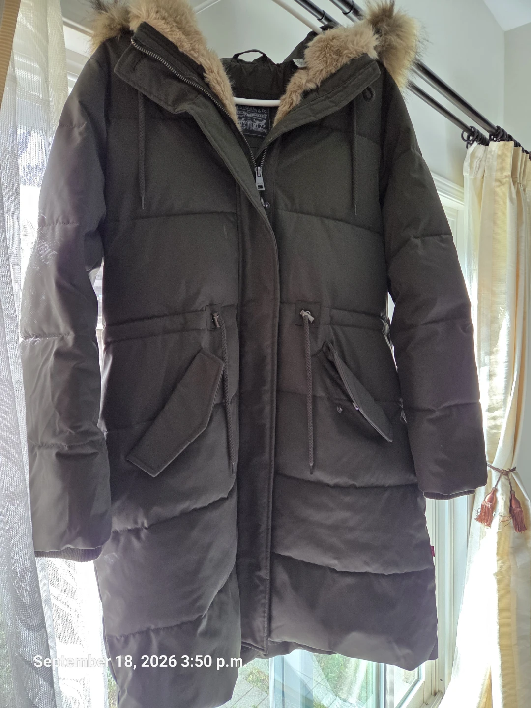 Winter coat ,size medium, olive green color.