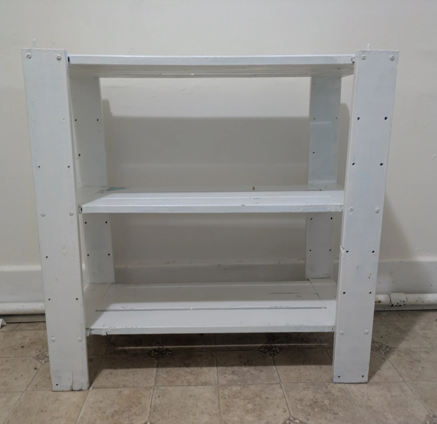 White three-tier wooden shelf unit