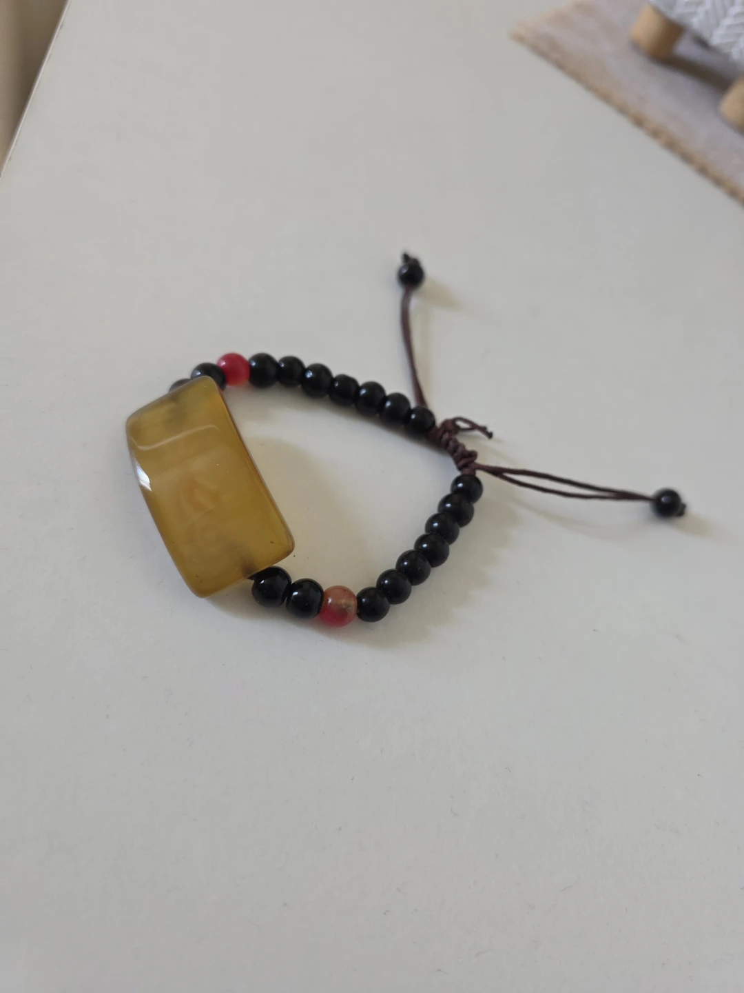 🏈 Adjustable Beaded Bracelet with Amber-Tone Piece