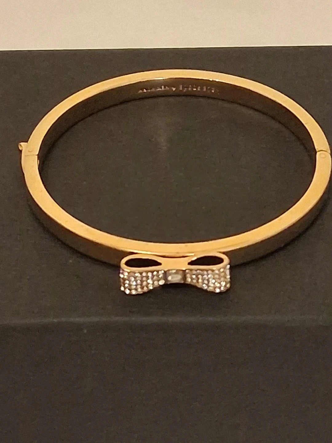 Kate Spade New York gold tone bow hinge bangle
