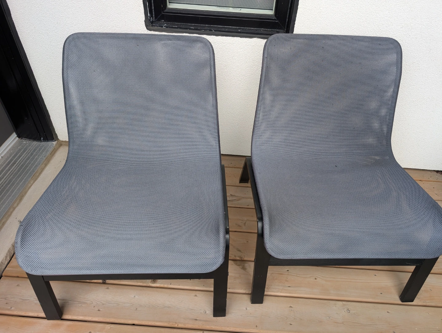 Two outdoor mesh chairs
