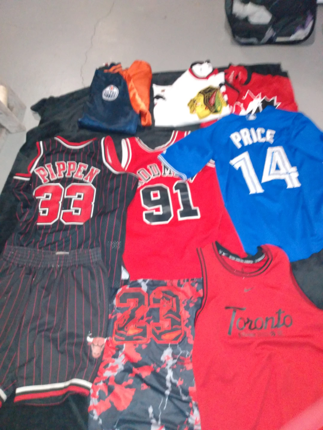 Assorted Sports Jerseys and Shorts Lot