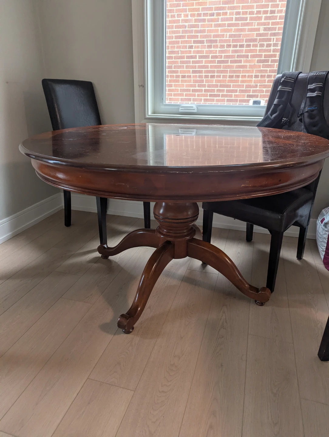 Round Wooden Pedestal Dining Table