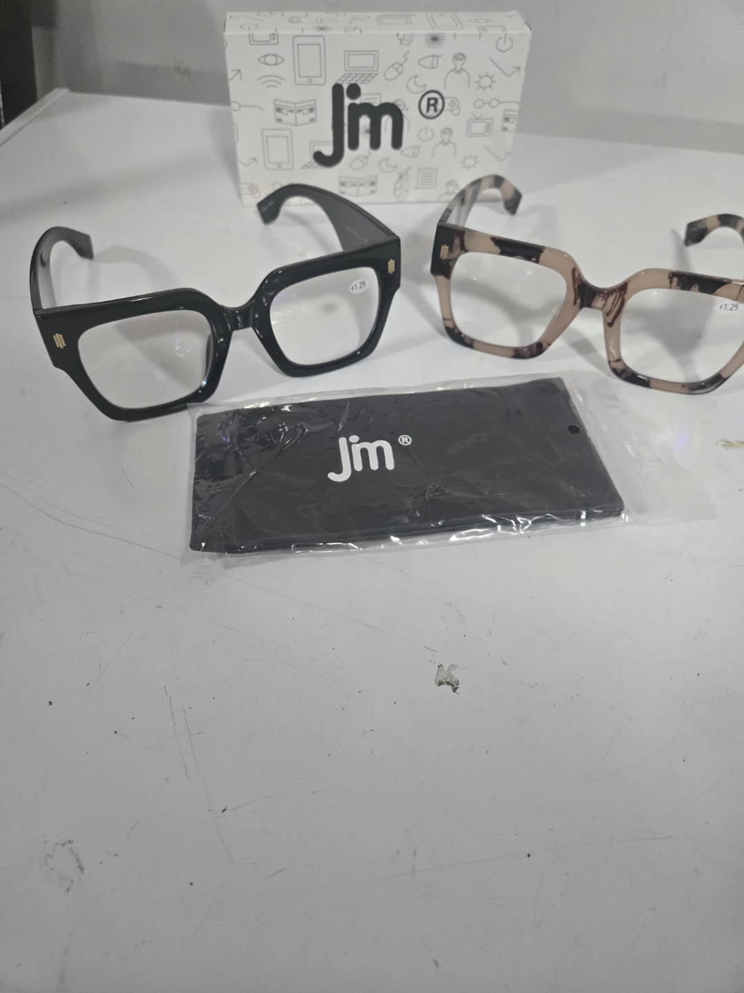 Two pairs of Jim reading glasses
