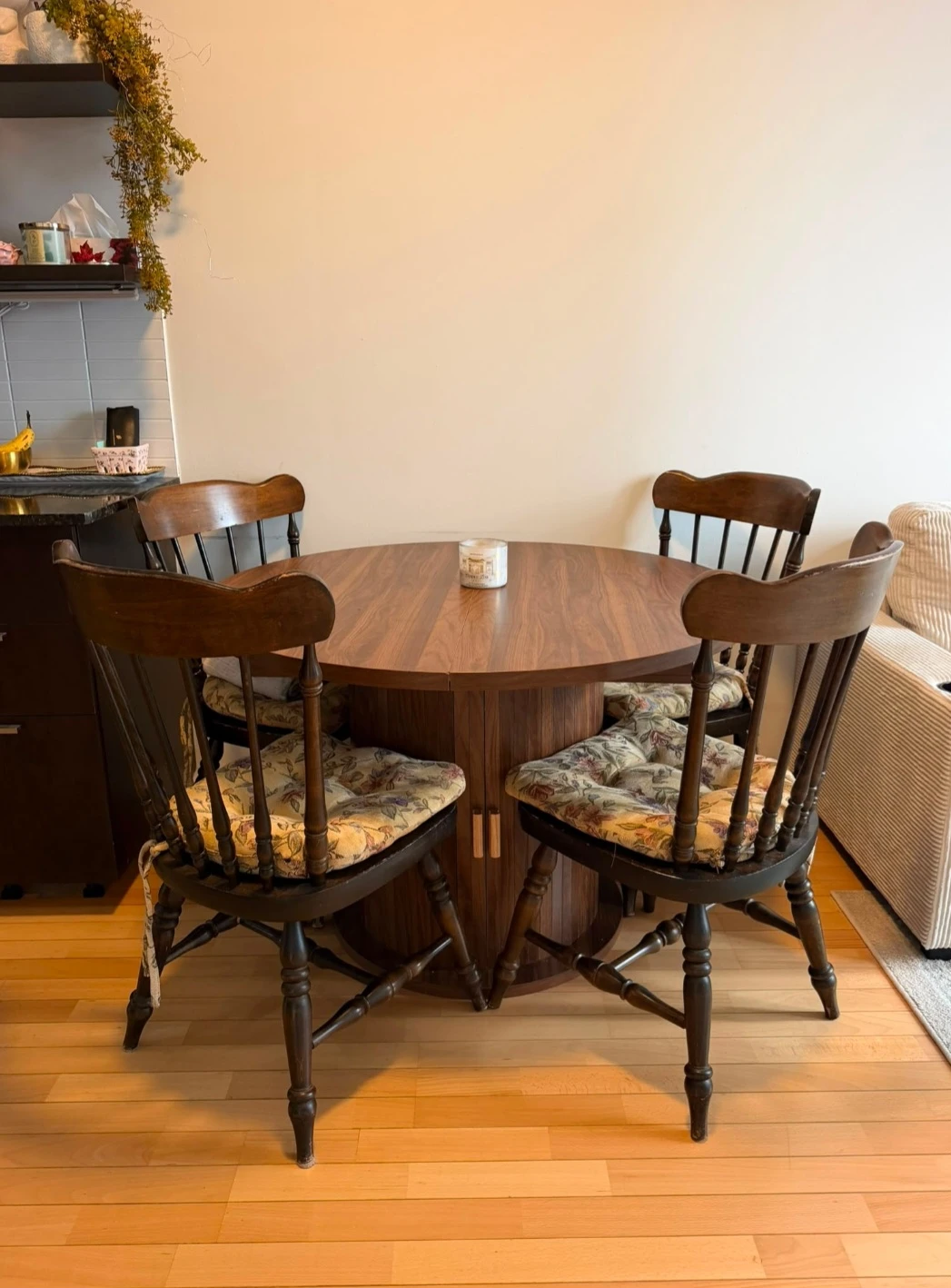 Round wooden dining table with storage base + 4 dining chairs