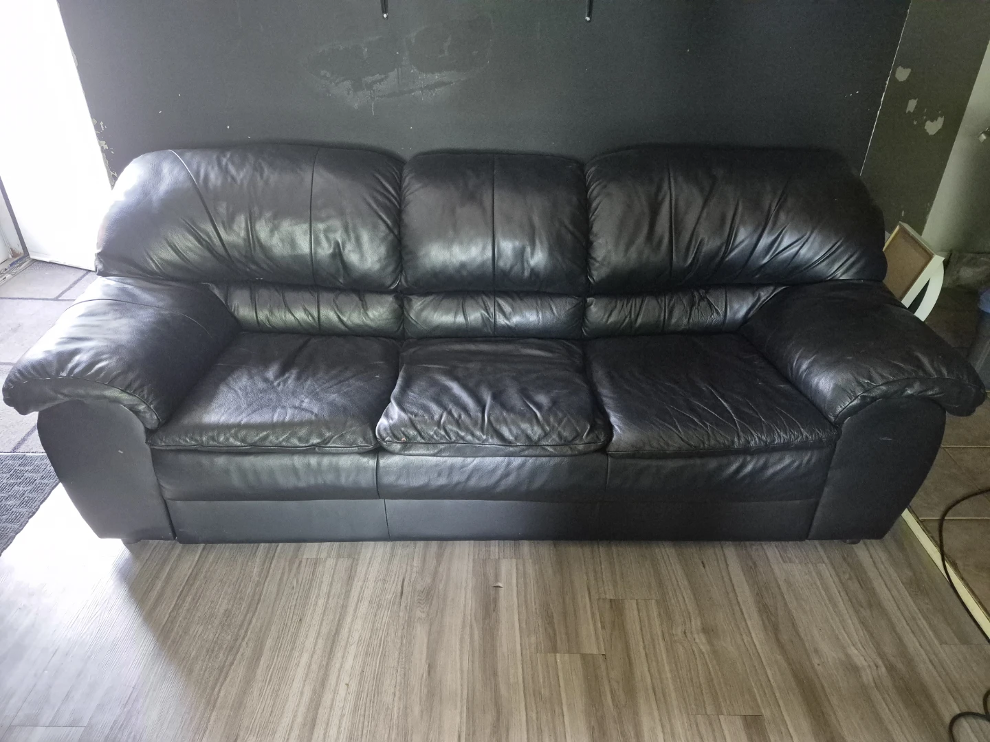 Black Leather Three-Seater Sofa