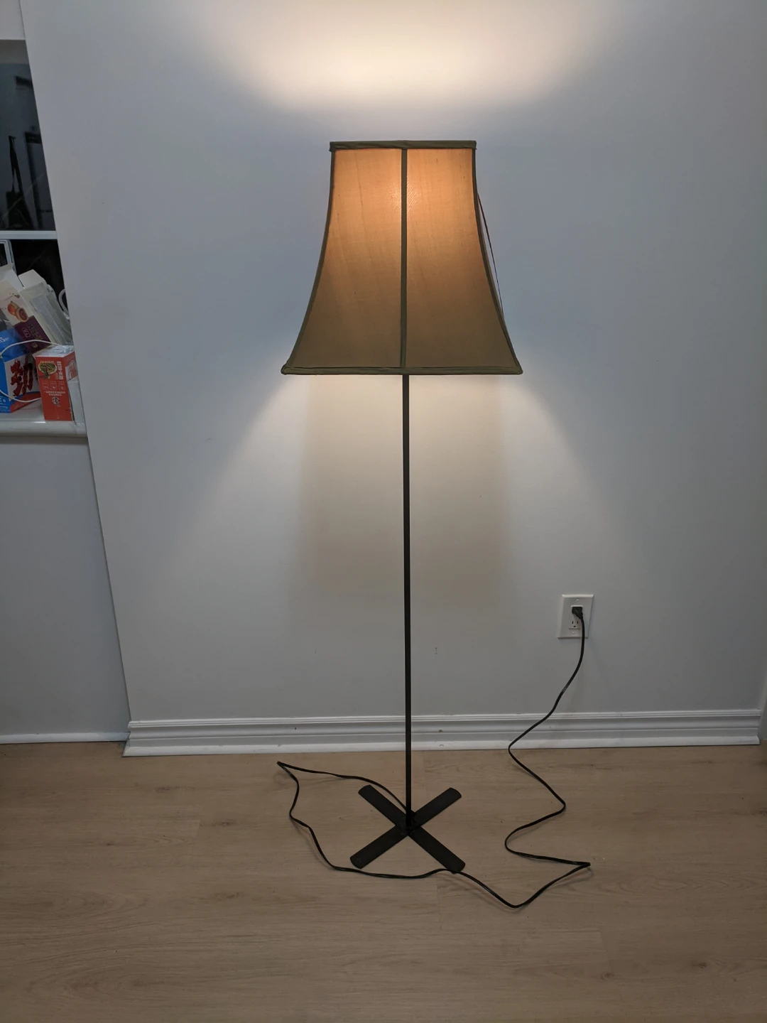 Minimalist floor lamp with tan shade