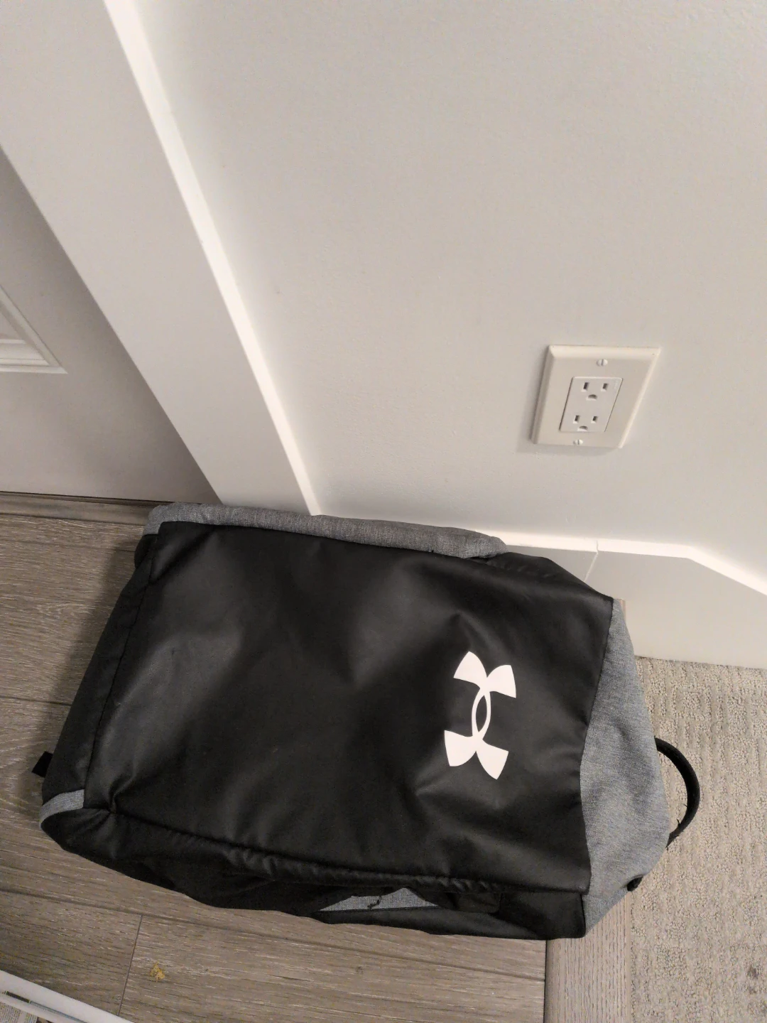 Under Armour grey and black duffel bag