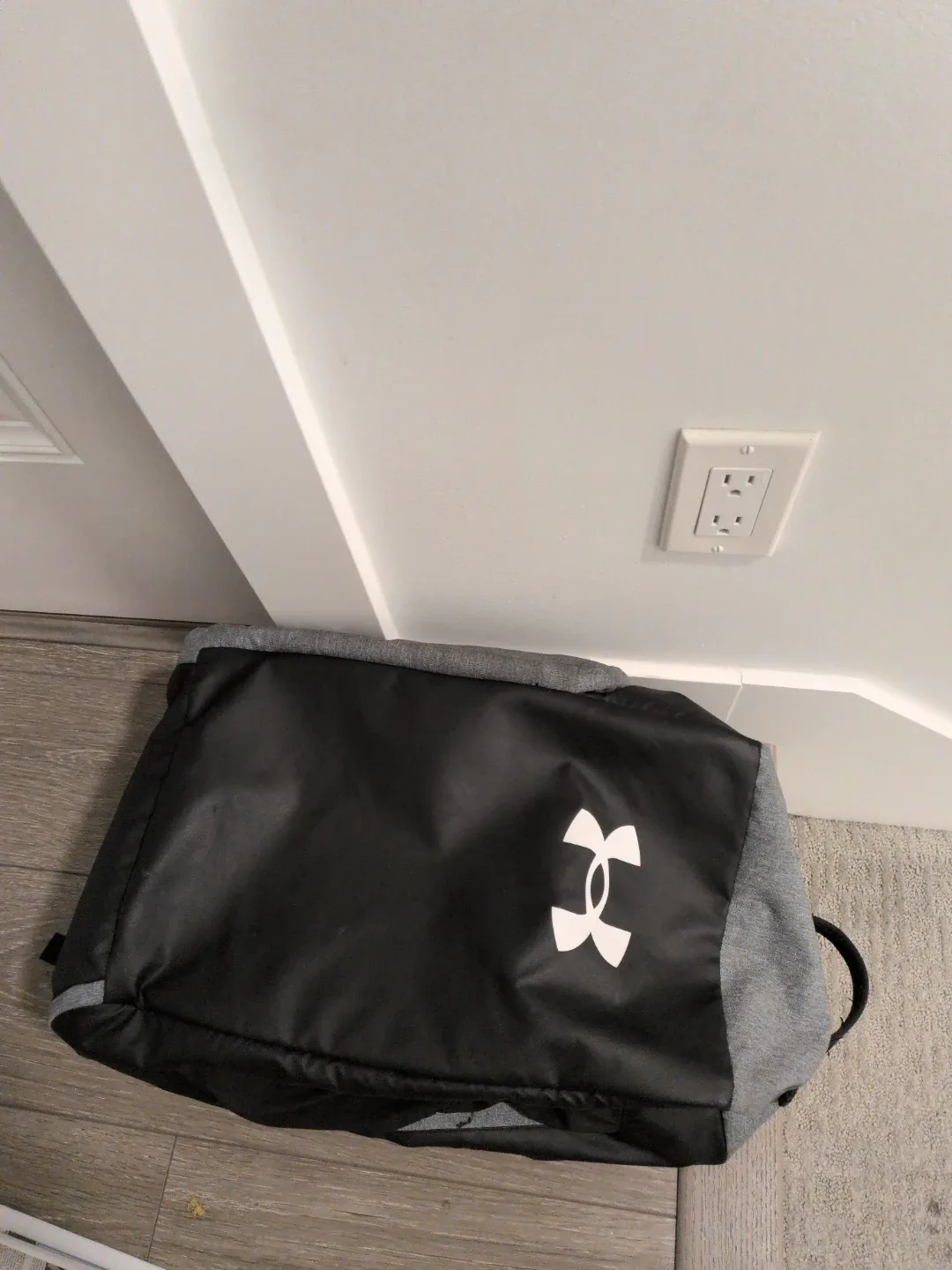 Under Armour grey and black duffel bag